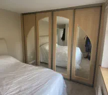 Hand made 4 door arch in montana oak with champagne frames